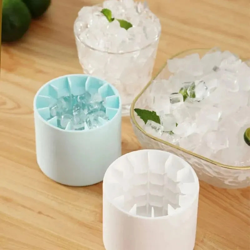 Silicone ice cube trays with ice cubes on a wooden surface