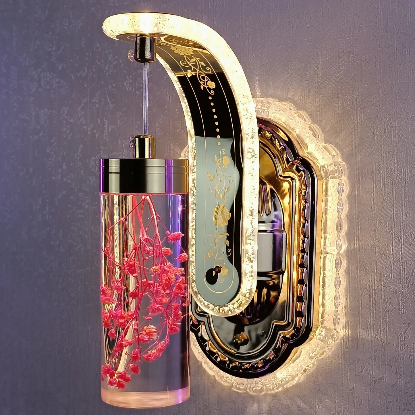 Decorative wall light fixture with floral design on a textured wall background