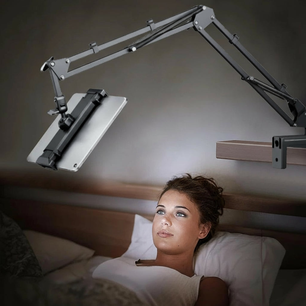 Woman lying in bed with a adjustable reading lamp above her.