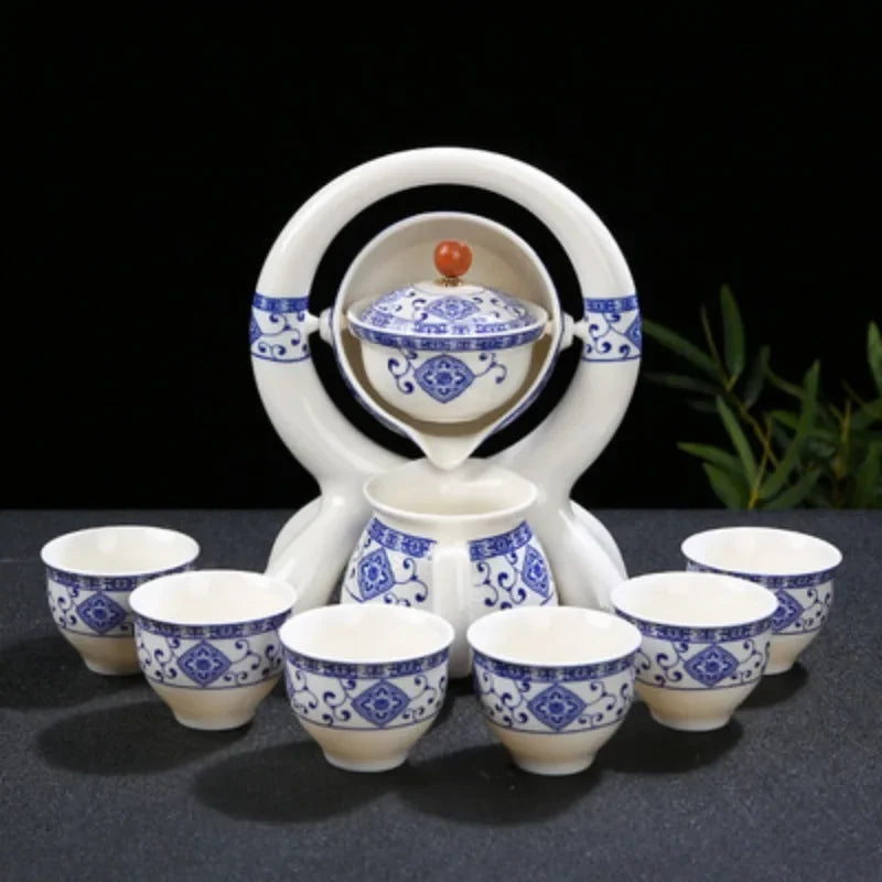 Ceramic tea set with blue and white patterns on a black background