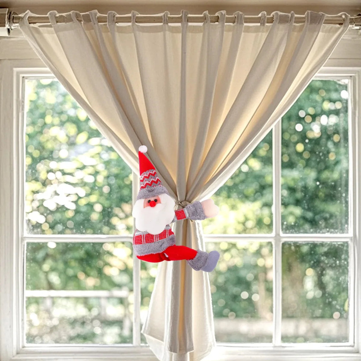 Decorative gnome hanging on a curtain with a window in the background