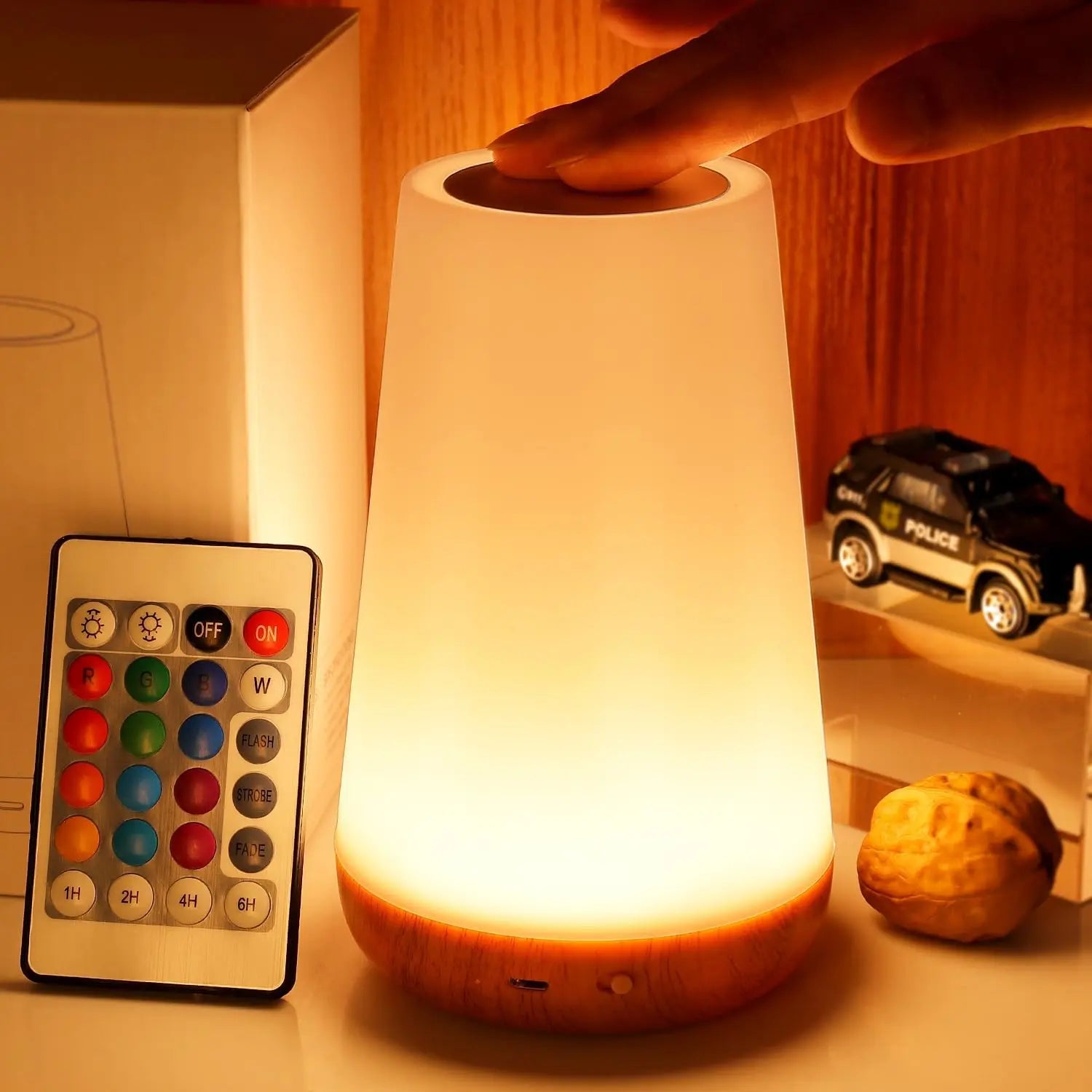 Futuristic night light with remote control on a wooden surface