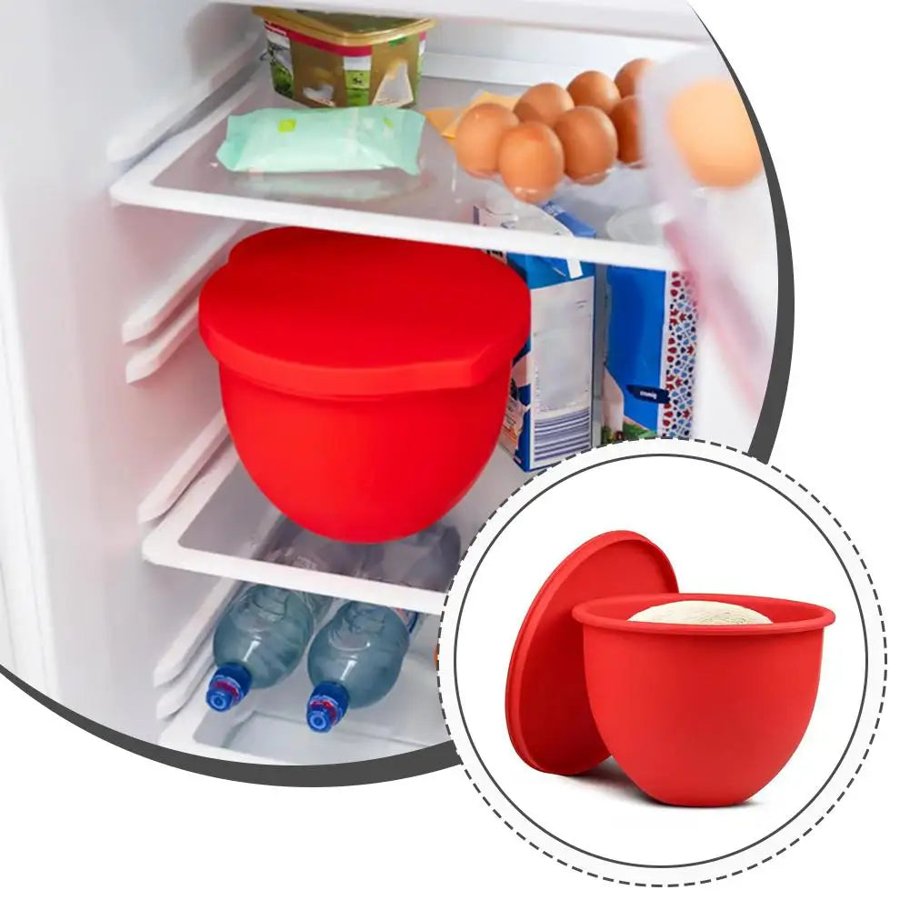 Red silicone container with lid inside a refrigerator with eggs and water bottles.