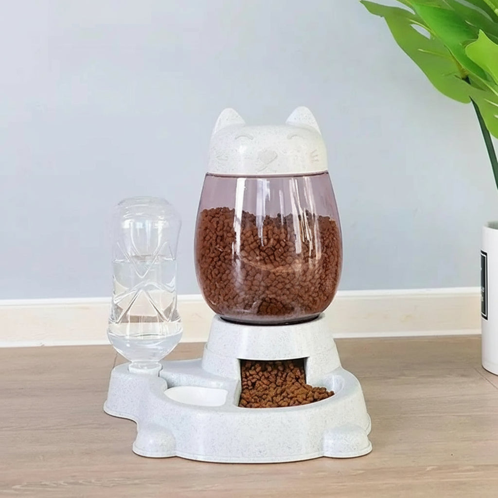 Pet feeding and drinking station with water and food compartments on a wooden surface.