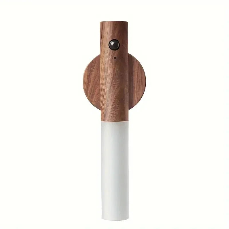 Wooden pepper grinder with white base on a white background