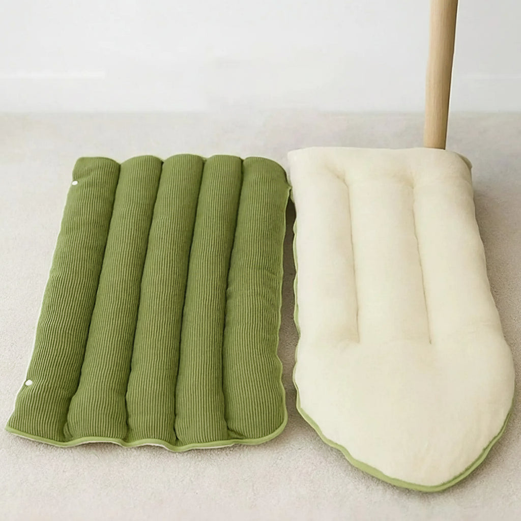 Green and white cushion with a side zipper for easy cleaning on a light background