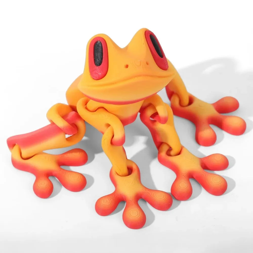 Orange and red toy frog on a white background