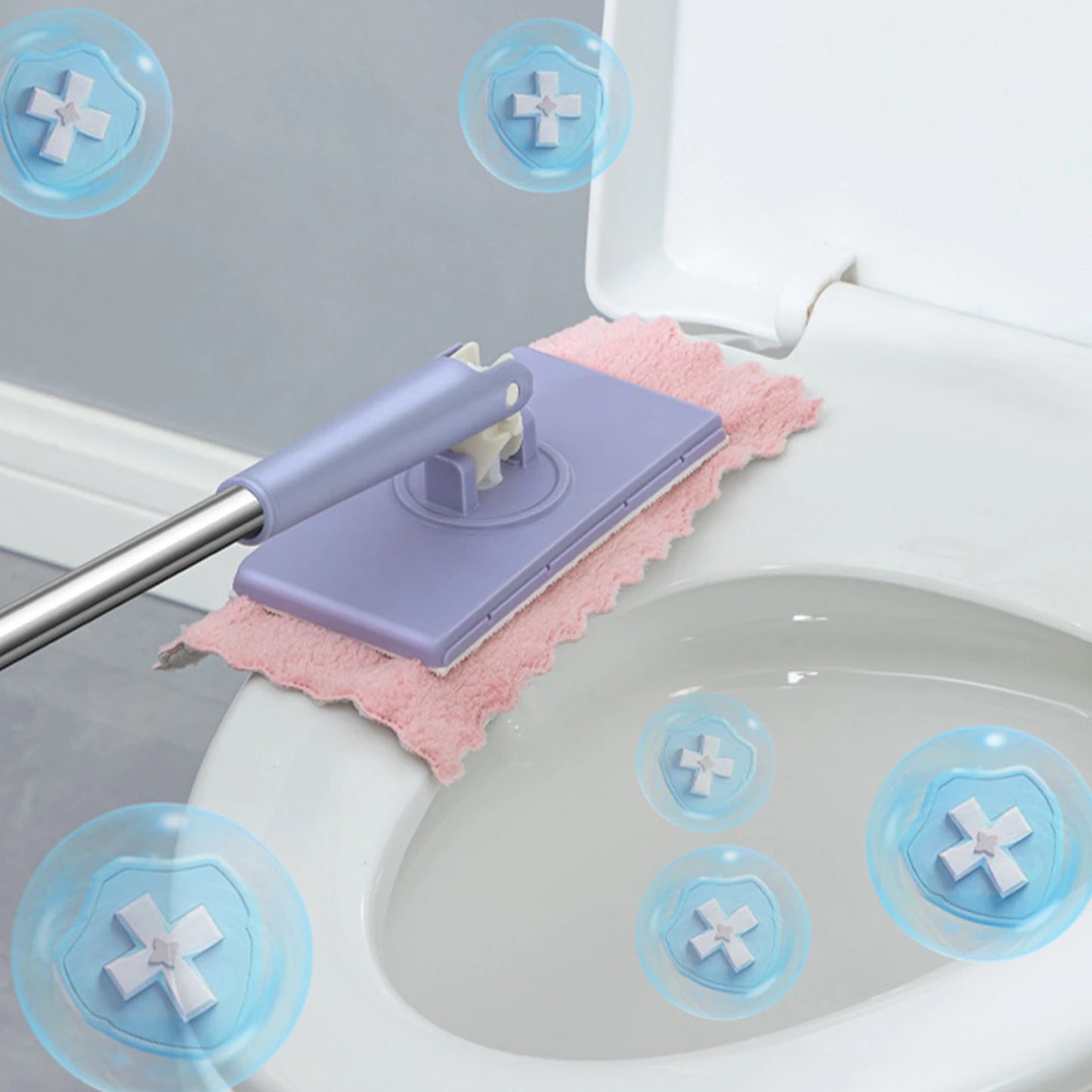 Cleaning tool with pink scrubber and blue suction cups on a toilet seat.