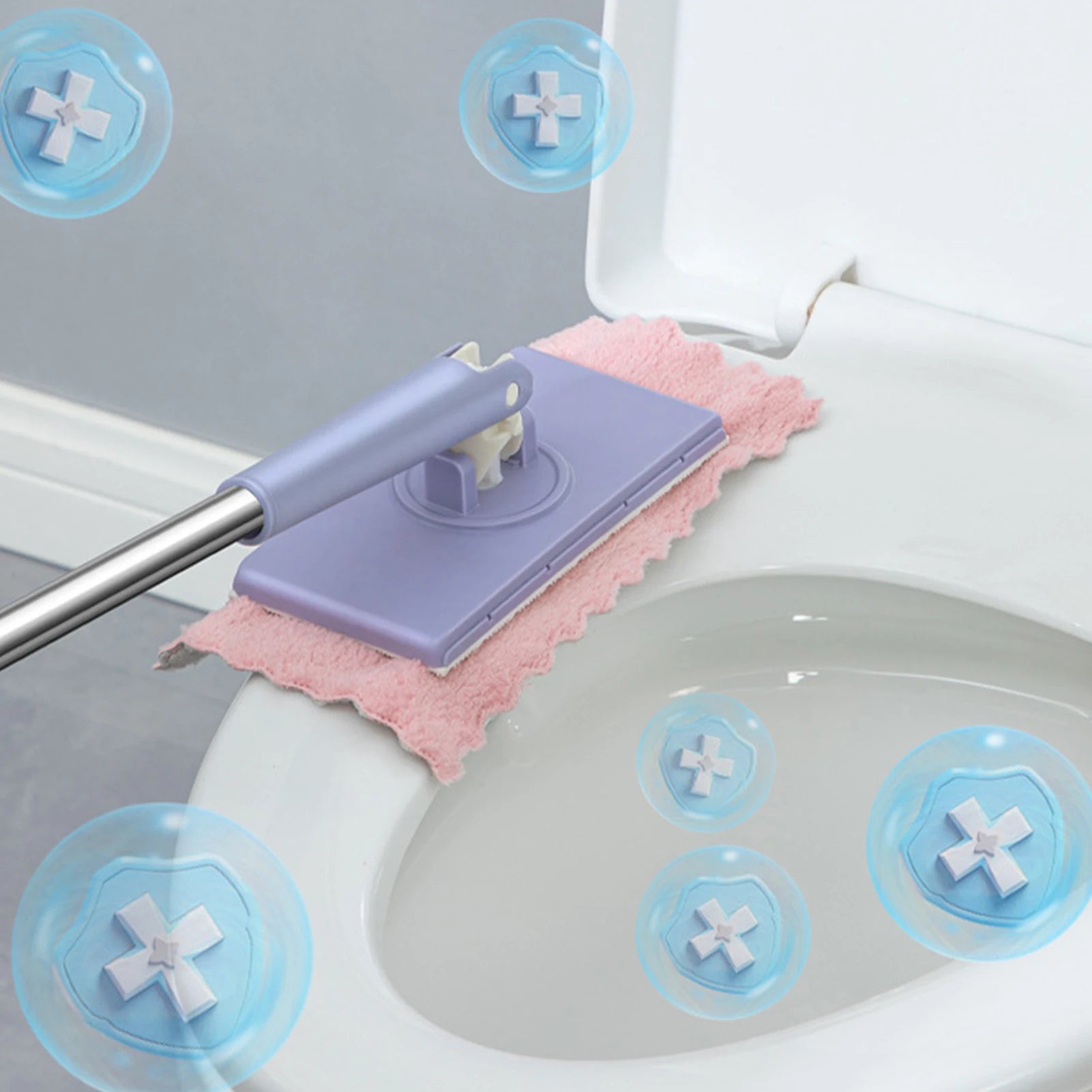 Cleaning tool with pink scrubber and blue suction cups on a toilet seat.