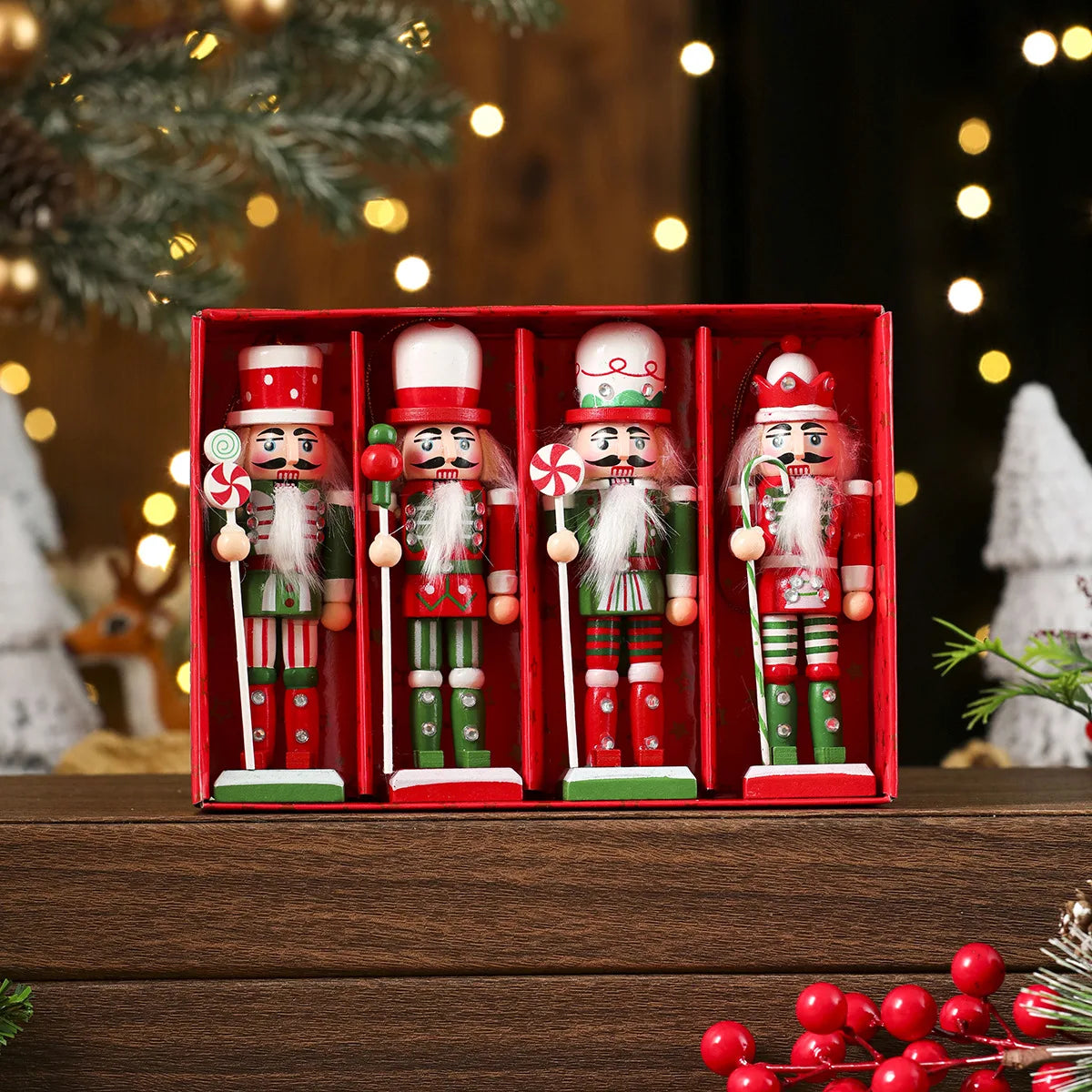 Set of four nutcracker figurines in a red box with Christmas decorations in the background.