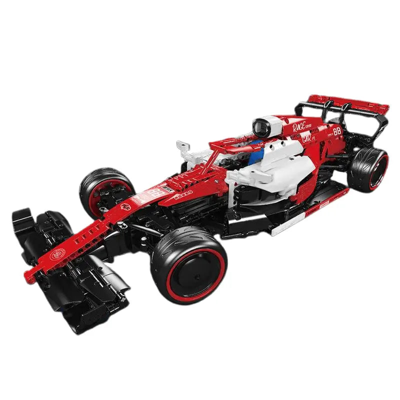 Model of a red and black racing car on a white background