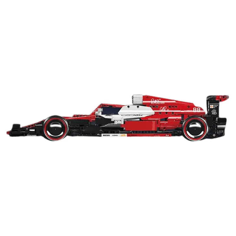 Model of a red and black Formula 1 car on a white background