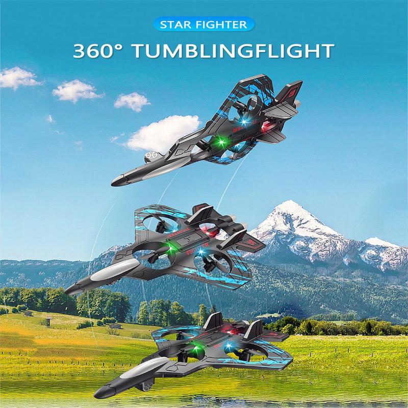 Toy star fighters performing 360-degree tumbling flight against a scenic background with mountains and sky.