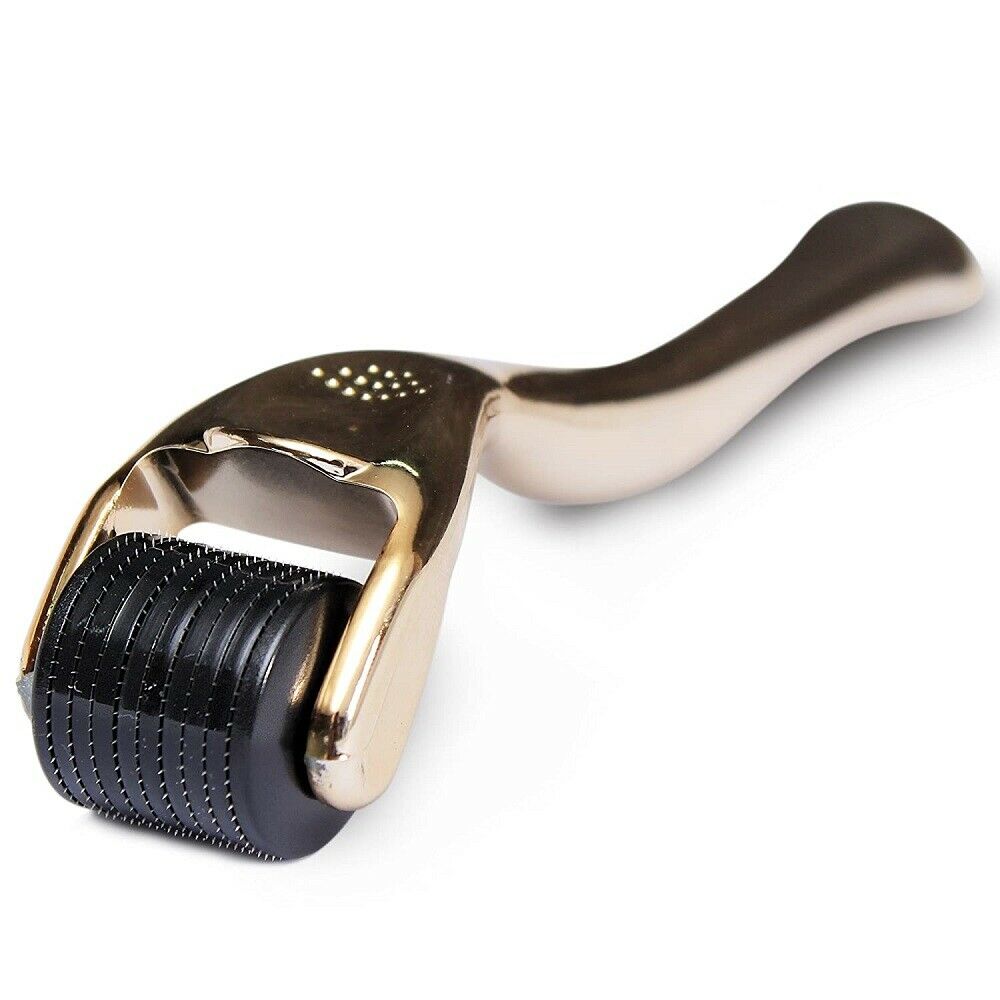 Derma roller with gold head and black cylindrical body on a white background