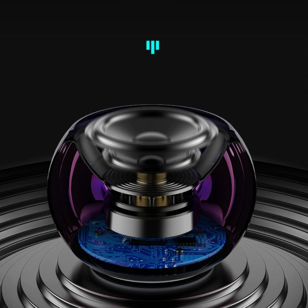 Black and purple electronic device with blue circuit board on a black background