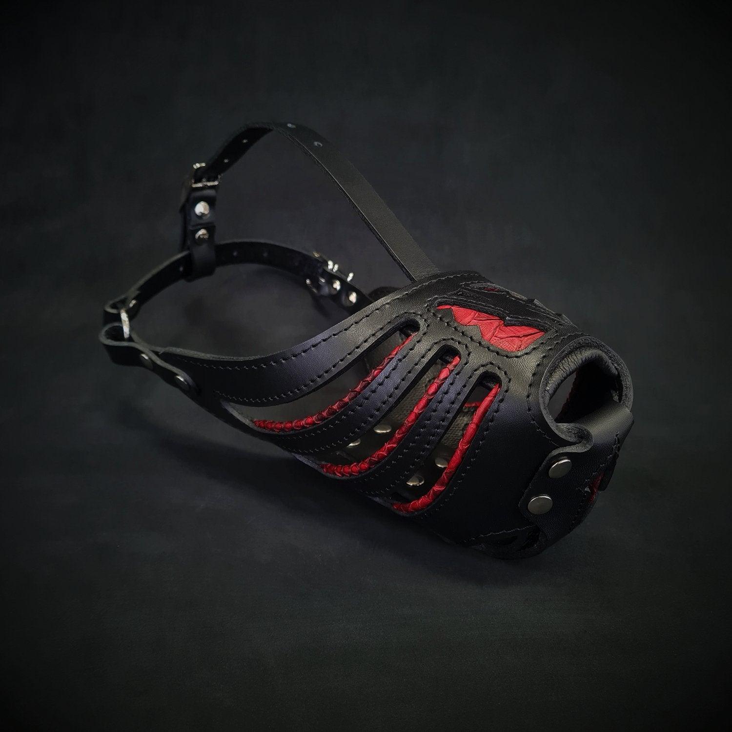Black leather muzzle with red accents on a dark background